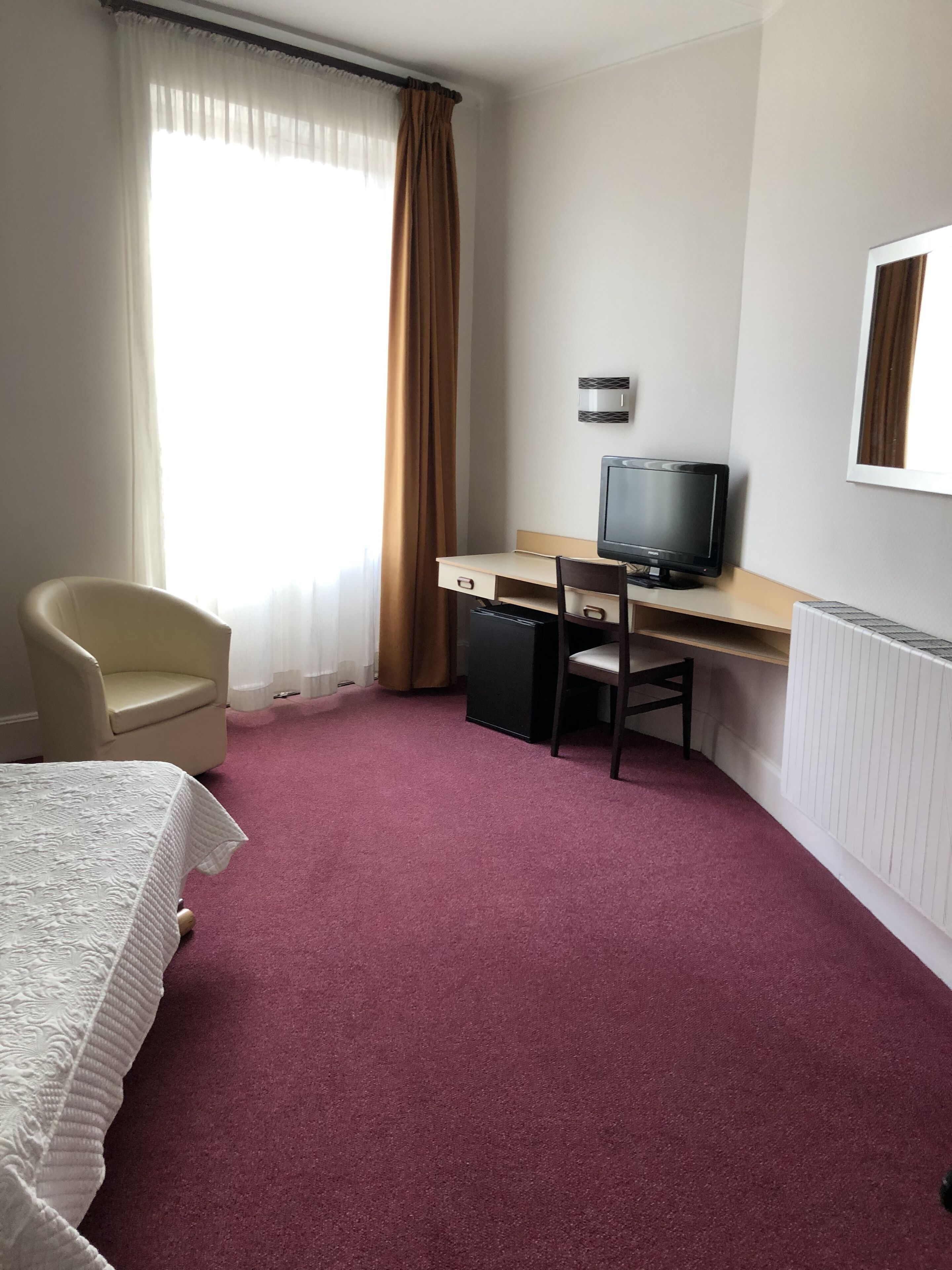 classic room, non smoking, city view | desk, laptop workspace, iron/ironing board, cots/infant beds