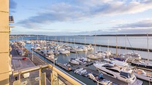 A marina with numerous boats docked in a harbor. - Riva -180-Degree Panoramic Views from Balcony (Poole)