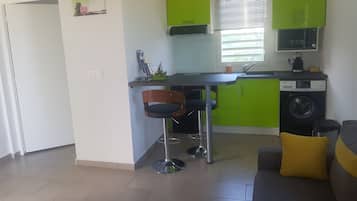 Fridge, microwave, stovetop, coffee/tea maker