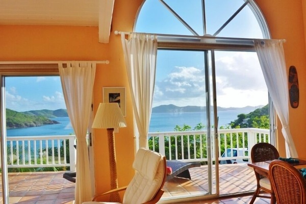 A feast of color and beauty nestled in lush island forest by the azure blue sea.