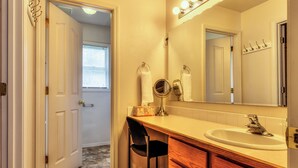 A bathroom with a vanity, sink, mirror, and towel rack. - GOLF COURSE, 4 Bdrm Single Level w/Garage!!! (Meridian)
