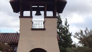 A welcome sign for St. Francis Winery & Vineyards with a stone wall and tiled roof in the background. - Best views on Sonoma Coast!Oceanfront,private hot tub, fire pit, pets considered (Bodega Bay)