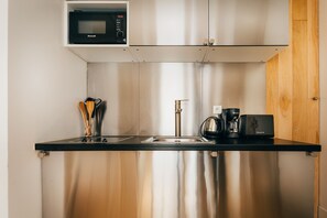 Fridge, microwave, stovetop, coffee/tea maker