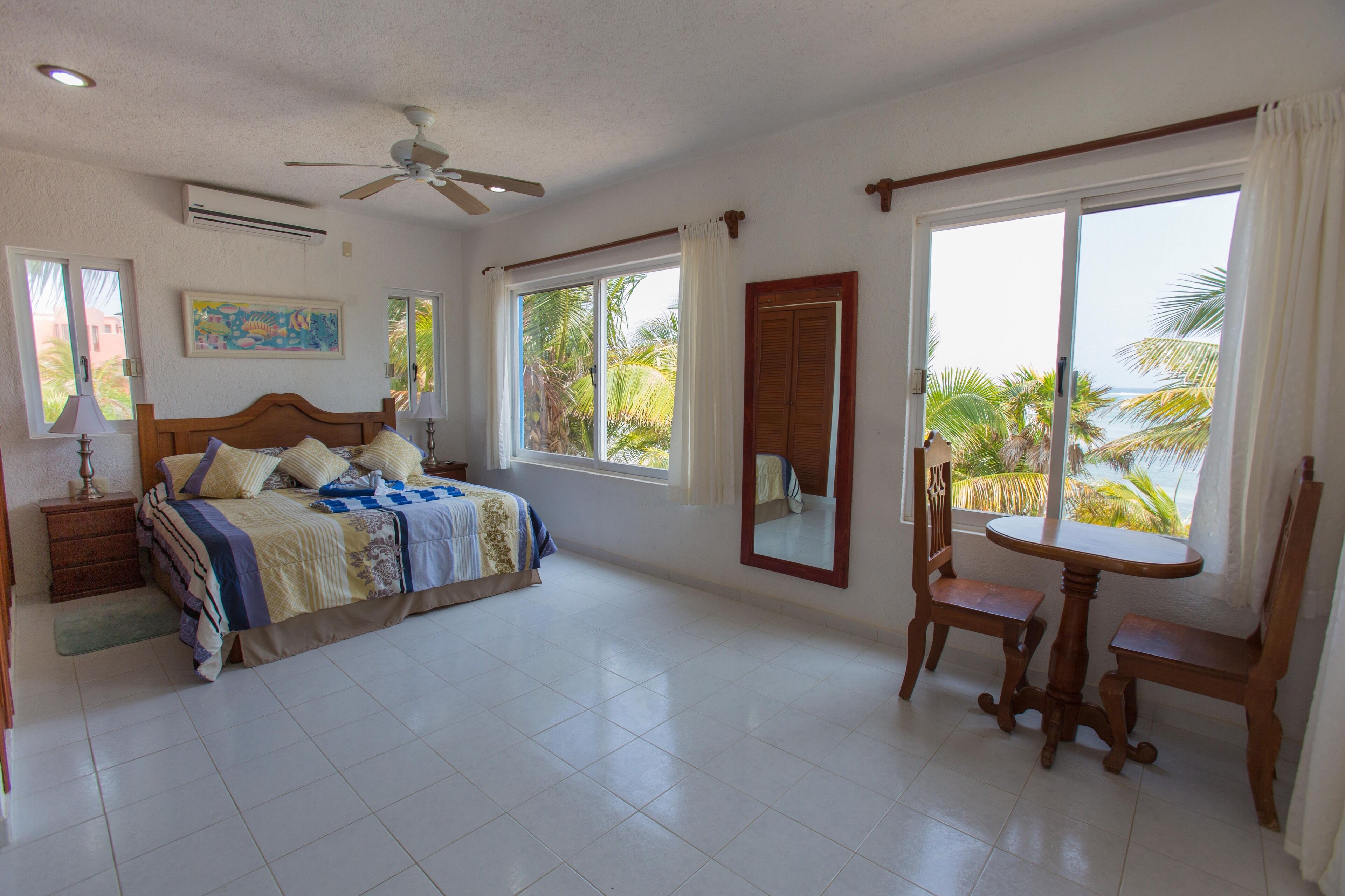 Master bedroom upstairs, with windows on 3 sides and 180 degree beach views