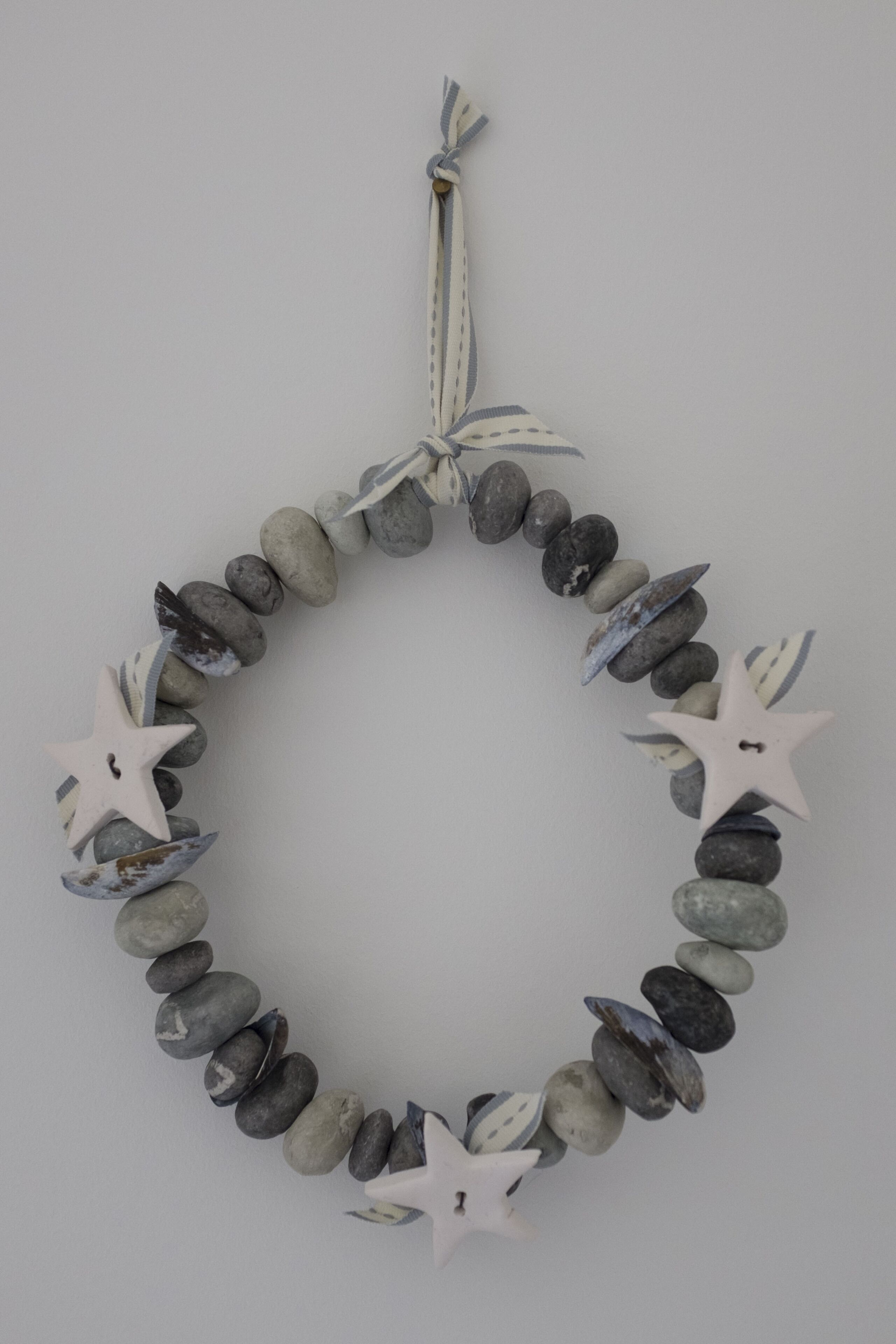 A necklace made of stones and star-shaped ornaments.