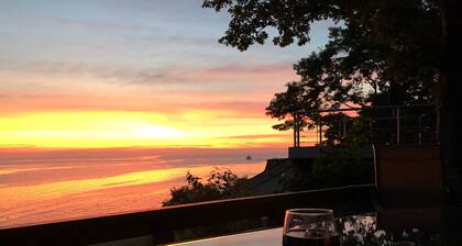 Lake Mich Cottage overlooking the beach with large deck to enjoy sunsets