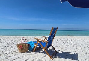 On the beach, sun-loungers