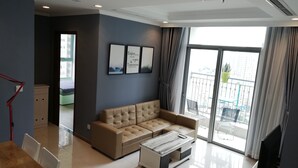 Deluxe Apartment, 2 Bedrooms, Pool View | Living area | Smart TV, fireplace - Vinhomes 4U (Ho Chi Minh City)
