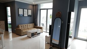 Deluxe Apartment, 2 Bedrooms, Pool View | Living area | Smart TV, fireplace - Vinhomes 4U (Ho Chi Minh City)