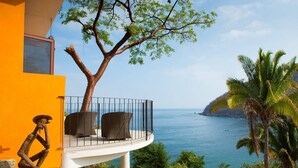 A balcony with wicker chairs overlooking a coastal view. - Lux in Yelapa, Infinity Pool, Huge Views, AC, Accommodates 8 to 10 (Yelapa)