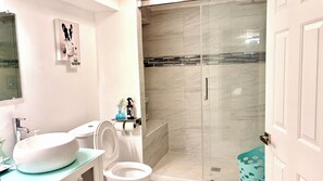 Combined shower/tub, hair dryer, towels, soap