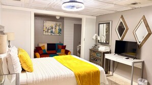 A bedroom with a bed, a desk, a TV, and a dresser. - Atlanta Pool Home Near Airport, Near Airport 8 guests Max (Atlanta)