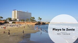 A beach scene with a hotel named Playa la Zenia.