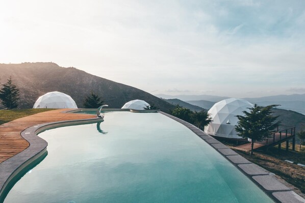 Seasonal outdoor pool, open 8:00 AM to 8:00 PM, sun loungers