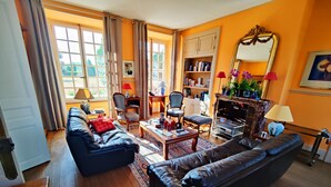 A living room with a sofa, chairs, a coffee table, and a fireplace. - CHARMING RESIDENCE with swimming pool and indoor spa (Conches-en-Ouche)