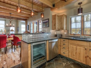 Enjoy cooking in this kitchen with a central island, dishwasher, and large window.