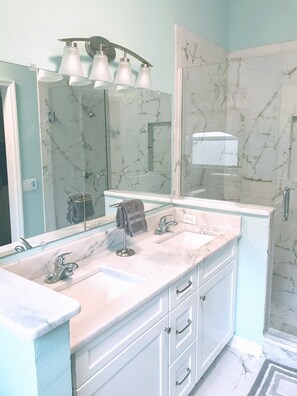 Combined shower/tub, hair dryer, towels, toilet paper