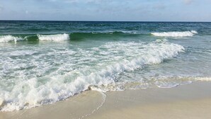 A beach with waves approaching the shore. - HangLoose14AD-Beautiful Beach Cottage@ the Purple Parrot Resort/Perdido Key FL (Pensacola)