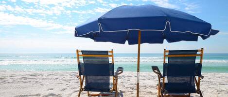On the beach, sun-loungers