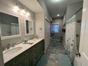 Combined shower/tub, hair dryer, towels, soap