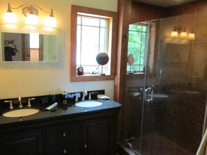 Shower, hair dryer, towels, shampoo