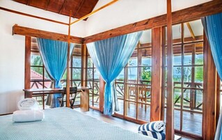 Caribbean House Ocean Front, King Size Suite | Premium bedding, down comforters, pillowtop beds, in-room safe