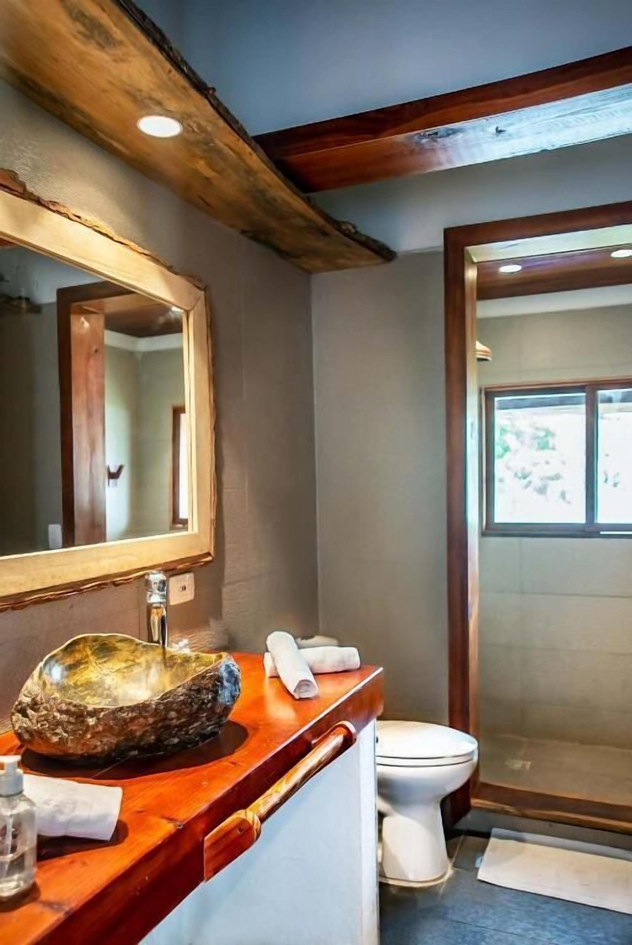 caribbean house ocean front, king size suite | bathroom | shower, rainfall showerhead, hair dryer, towels