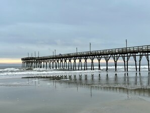 A pier extending into the ocean with a clear sky above. - Sunset Beach Golf & Beach Retreat - 2BR Condo with 10th Hole Views (Sunset Beach)