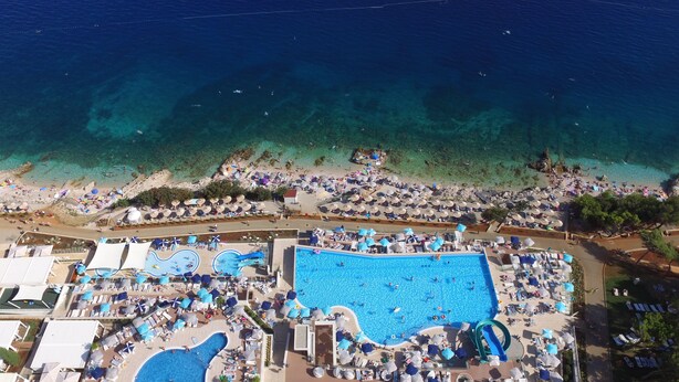 An aerial view of a resort with a large swimming pool, beach area, and multiple sun loungers. - Villa 5 stars , Istra , Croatia (Sveta Nedelja, Istarska županija)