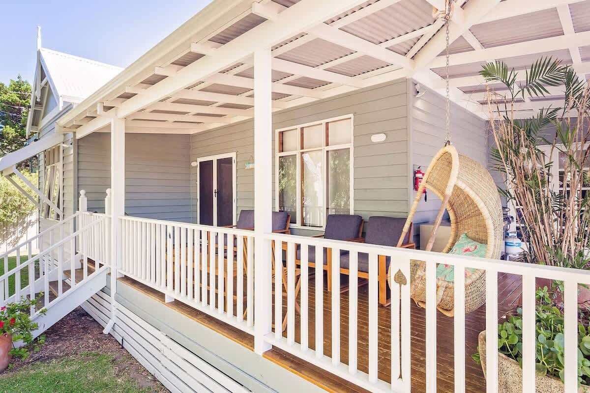  Enjoy morning coffee or an evening drink on the wide verandah, with comfortable seating and a tranquil outlook over the foreshore park.