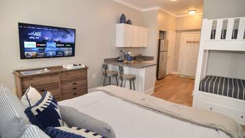 1 bedroom, desk, iron/ironing board, travel crib