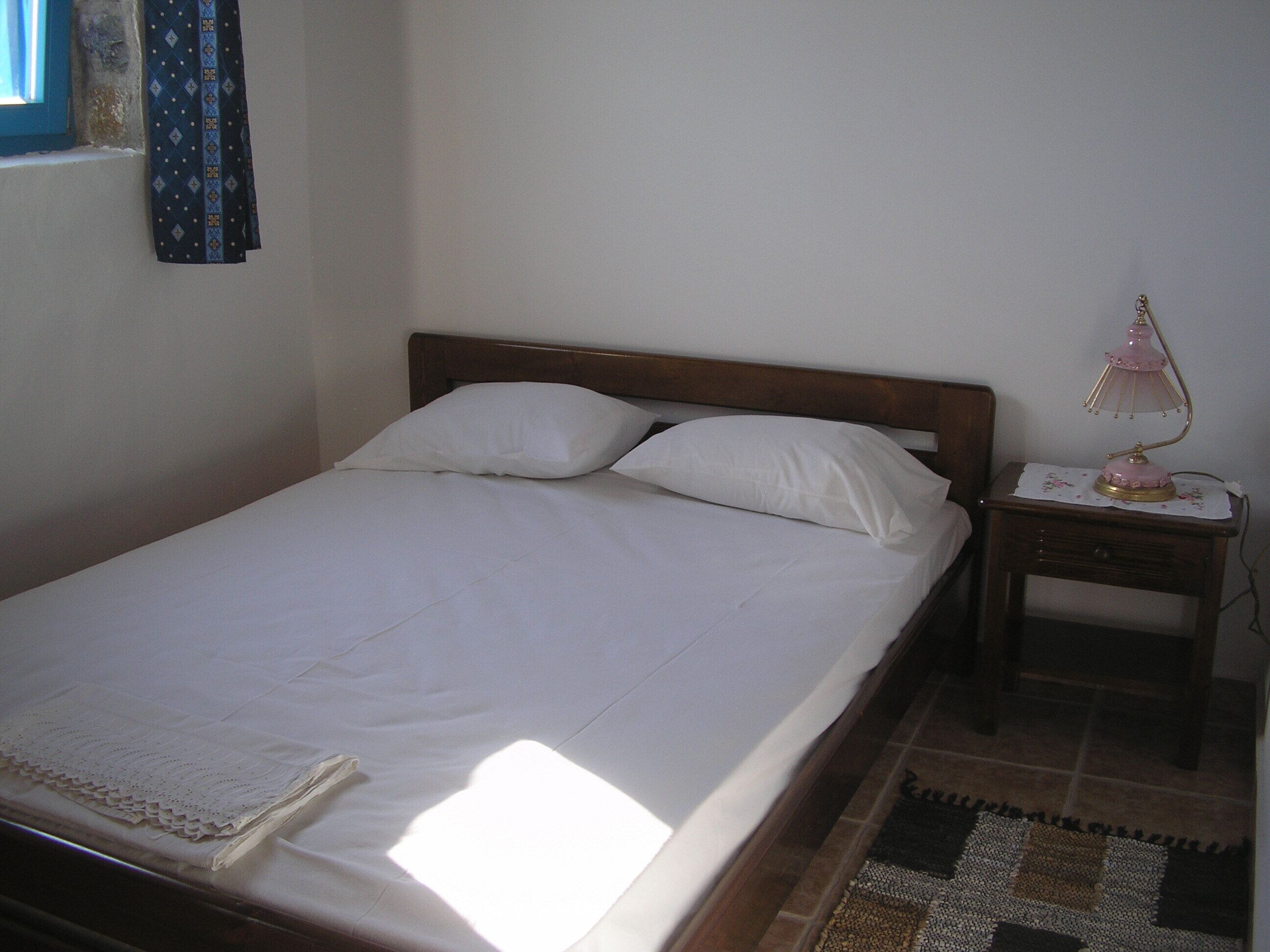 Two storey stone built house by the castle