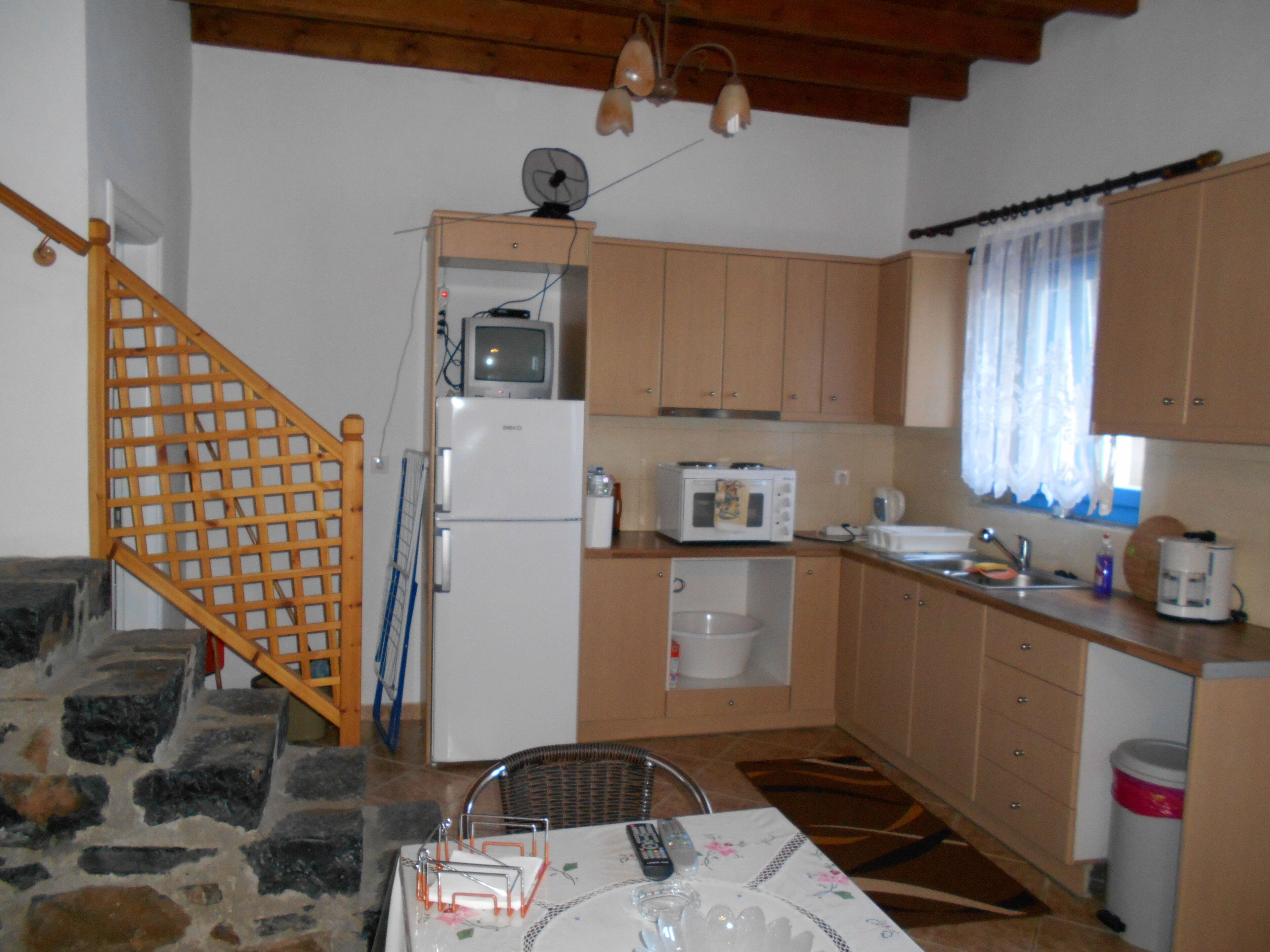 Two storey stone built house by the castle