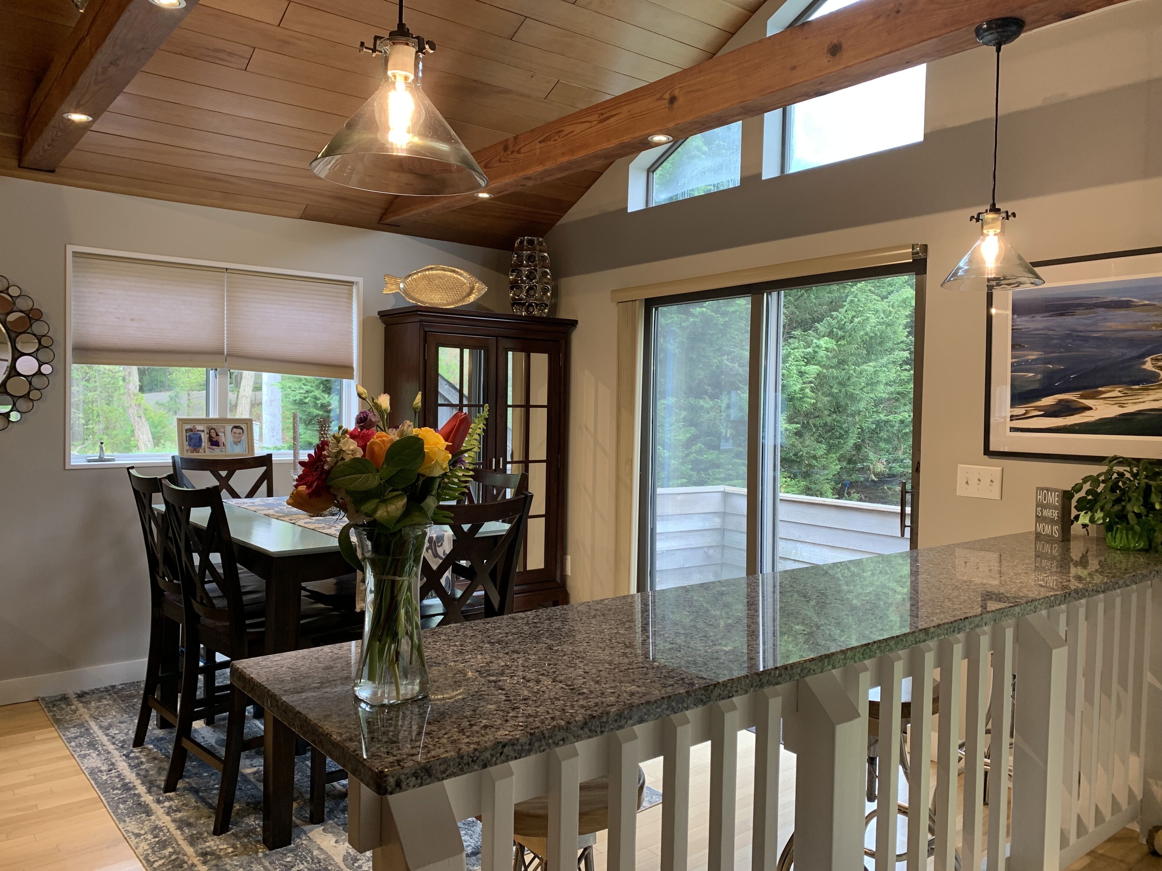 Granite counter seating which overlooks the living room