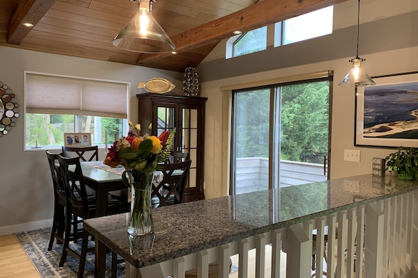 Granite counter seating which overlooks the living room