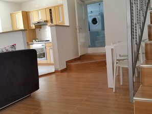 Enjoy a compact apartment with a kitchenette, dining area, and laundry facilities.