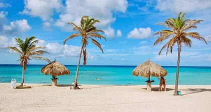 Vacation home with hotel service in sunny garden with pool, close to beach