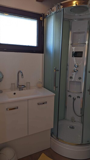 Shower, hair dryer, towels, soap