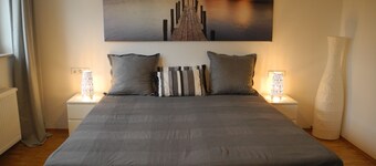 Bright modern apartment in a quiet location with its own entrance and patio