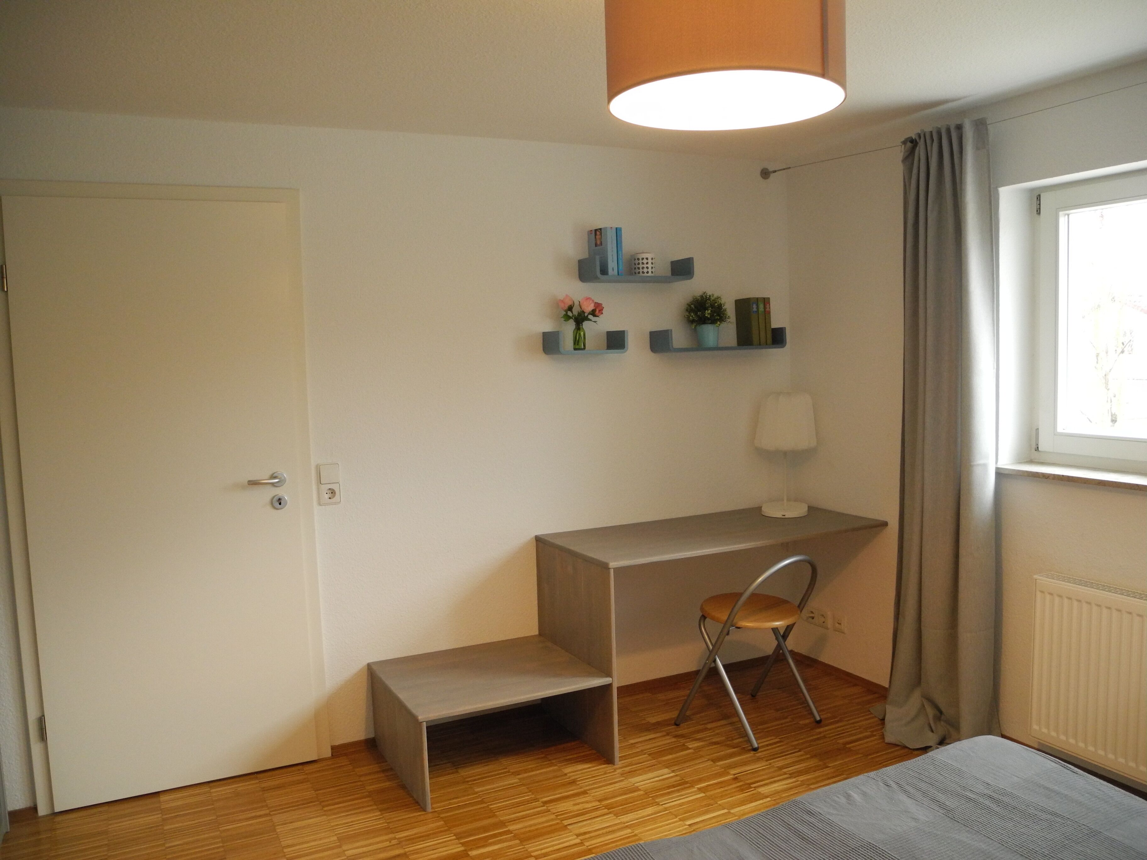 Bright modern apartment in a quiet location with its own entrance and patio