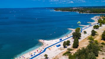 On the beach, sun-loungers