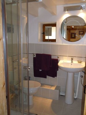 Shower, hair dryer, towels, toilet paper