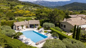 Outdoor pool, a heated pool, sun loungers