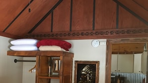 A room with a bunk bed, a small kitchenette, and a wooden ceiling. - Cozy one bedroom Hideaway Resort cabin #6 (Chippewa Falls)