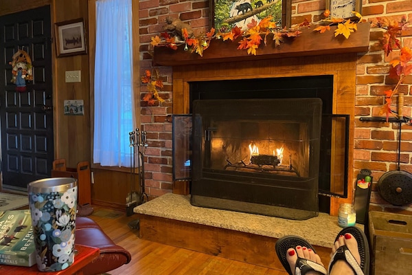 Relaxing in the recliner with some coffee and a nice little fire.