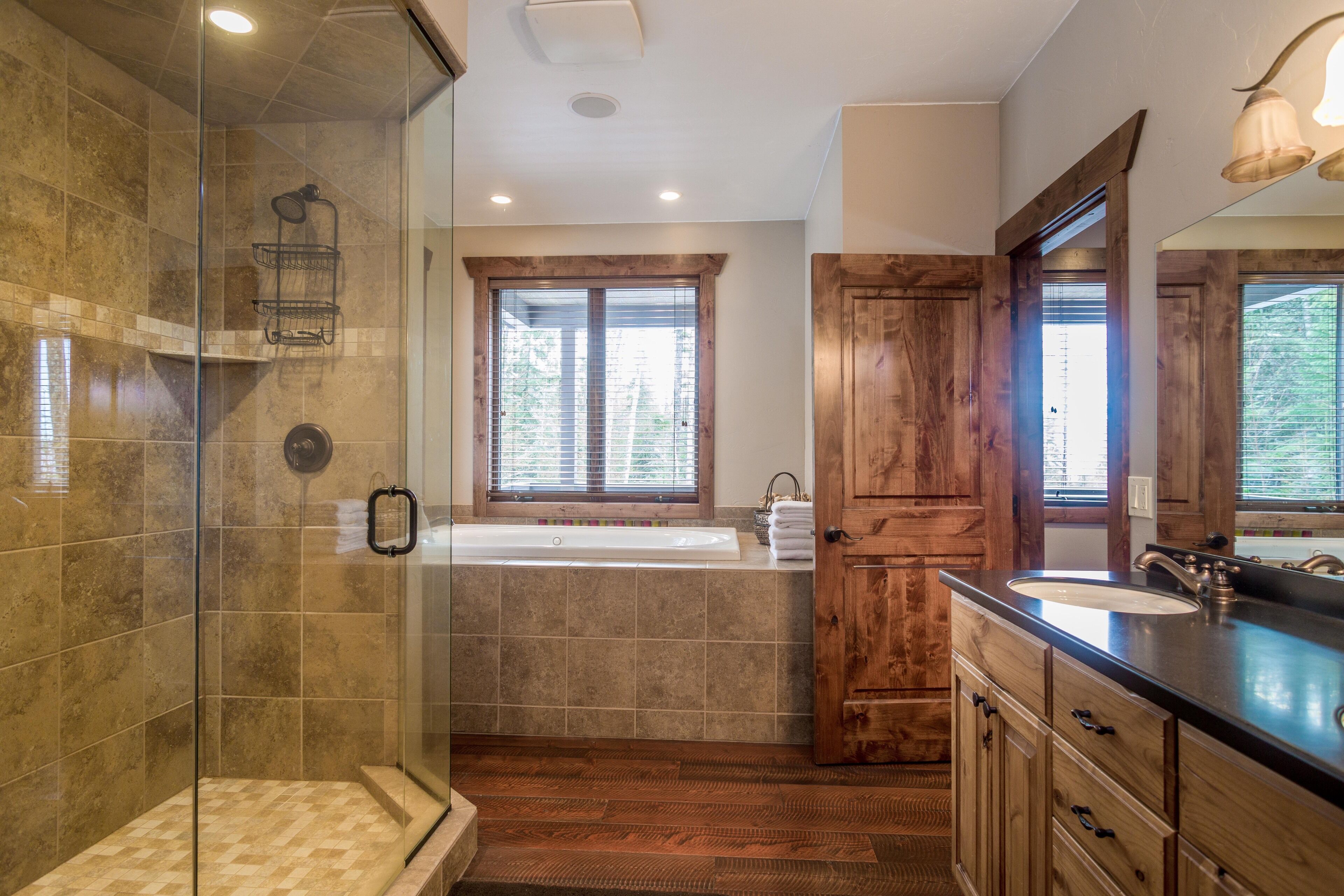Bathtub, hair dryer, towels, toilet paper