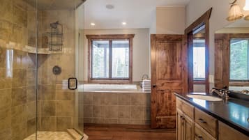 Bathtub, hair dryer, towels, toilet paper