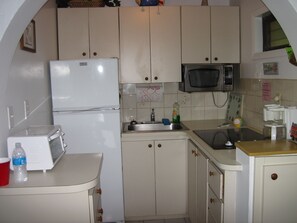 Fridge, microwave, stovetop, coffee/tea maker