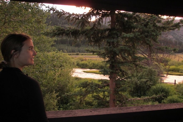 Views from the porch to Fish Creek, open ranch land and the mountain range.