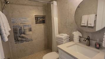 Bathtub, hair dryer, towels